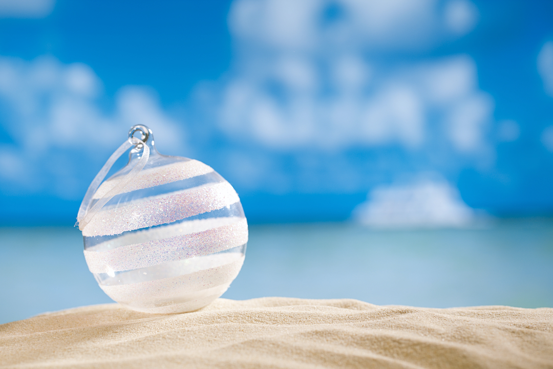 Christmas bauble on beaching front of seascape